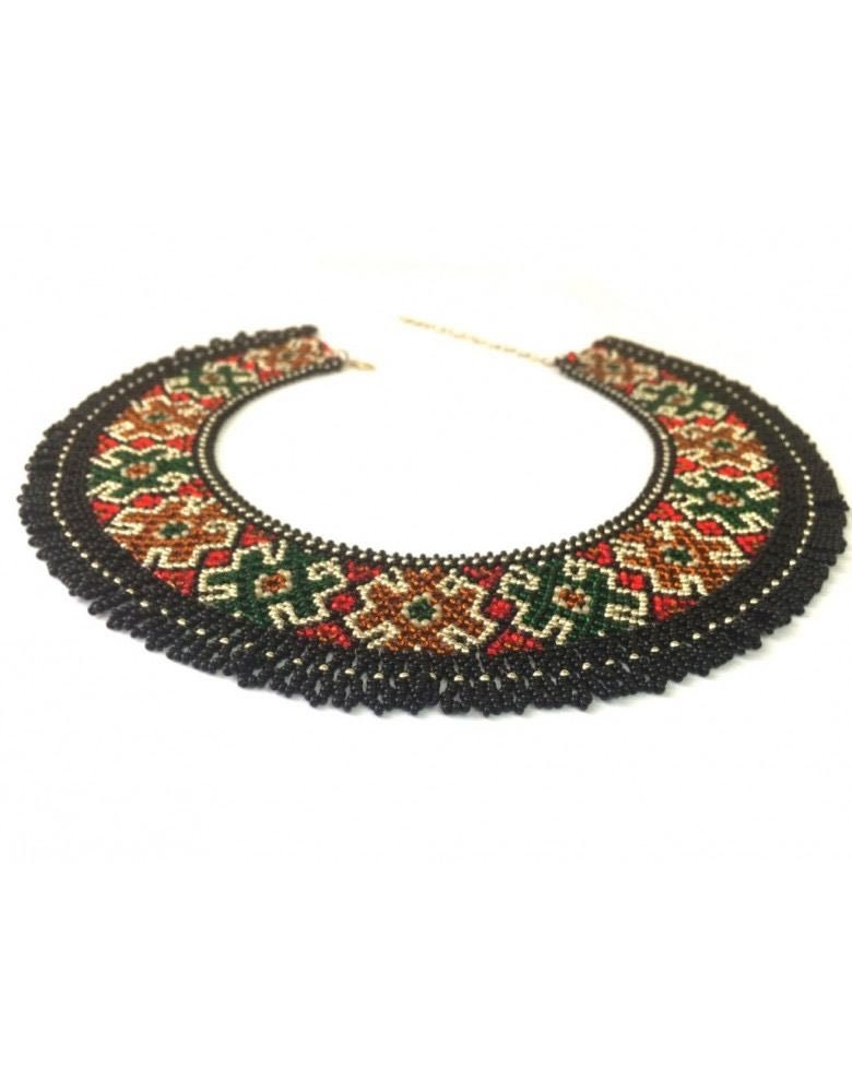 A traditional Ukrainian Hutsulska SYLYANKA beaded necklace featuring multicolored beads in geometric pattern.
