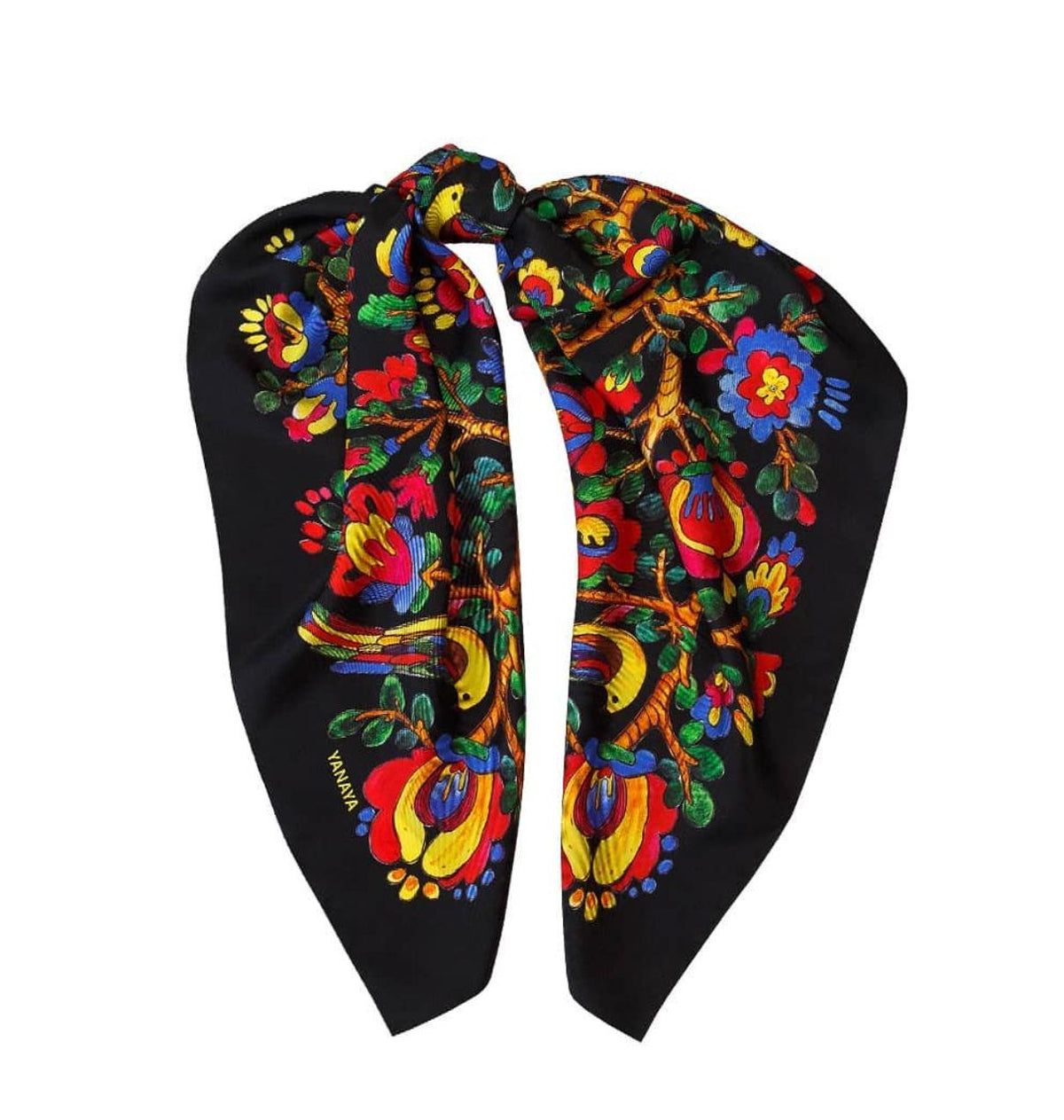 A black silk scarf featuring a vibrant, colorful floral and bird pattern, displayed on a clean white background.