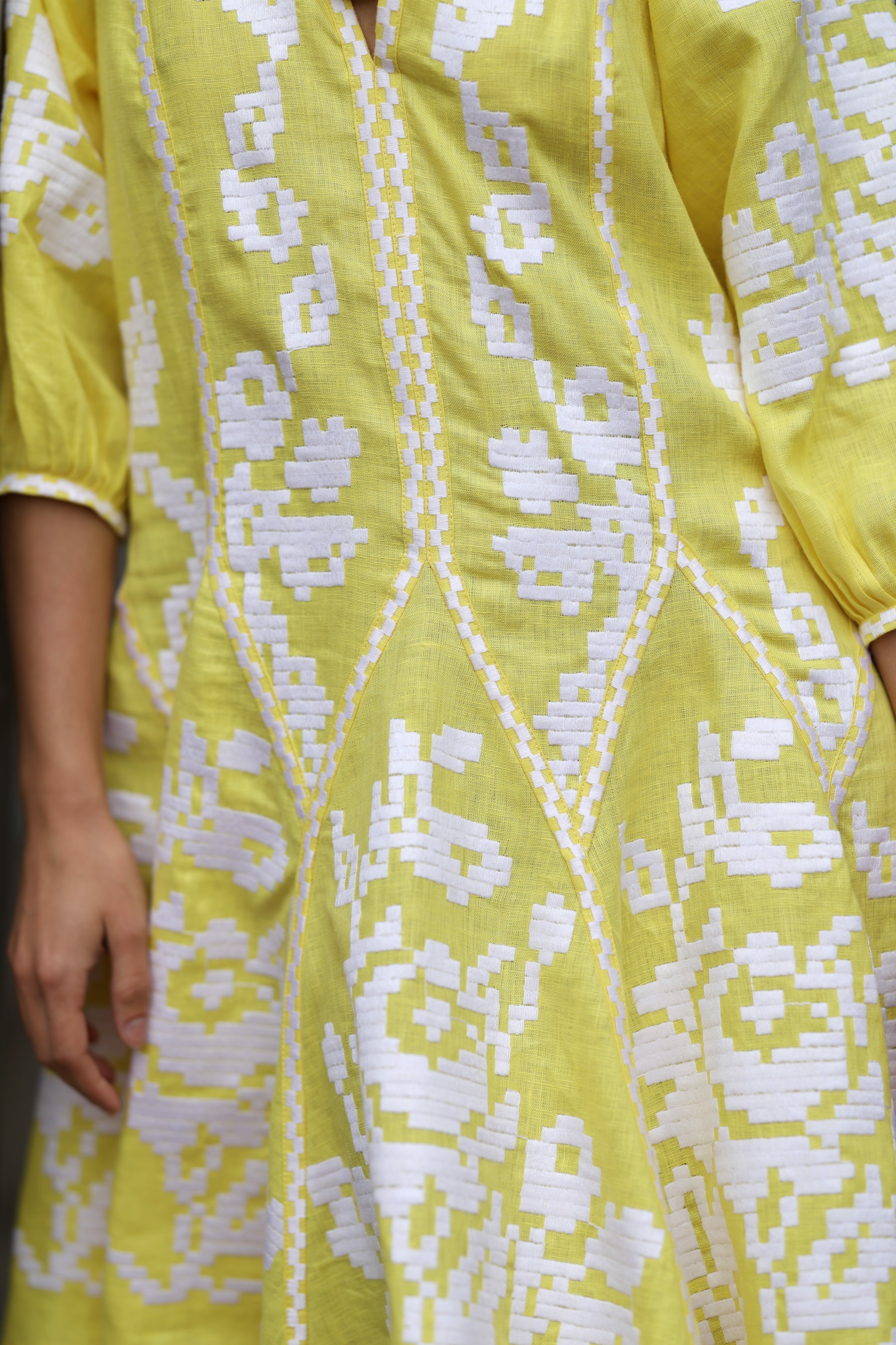 Women's bright yellow embroidered dress with white embroidery