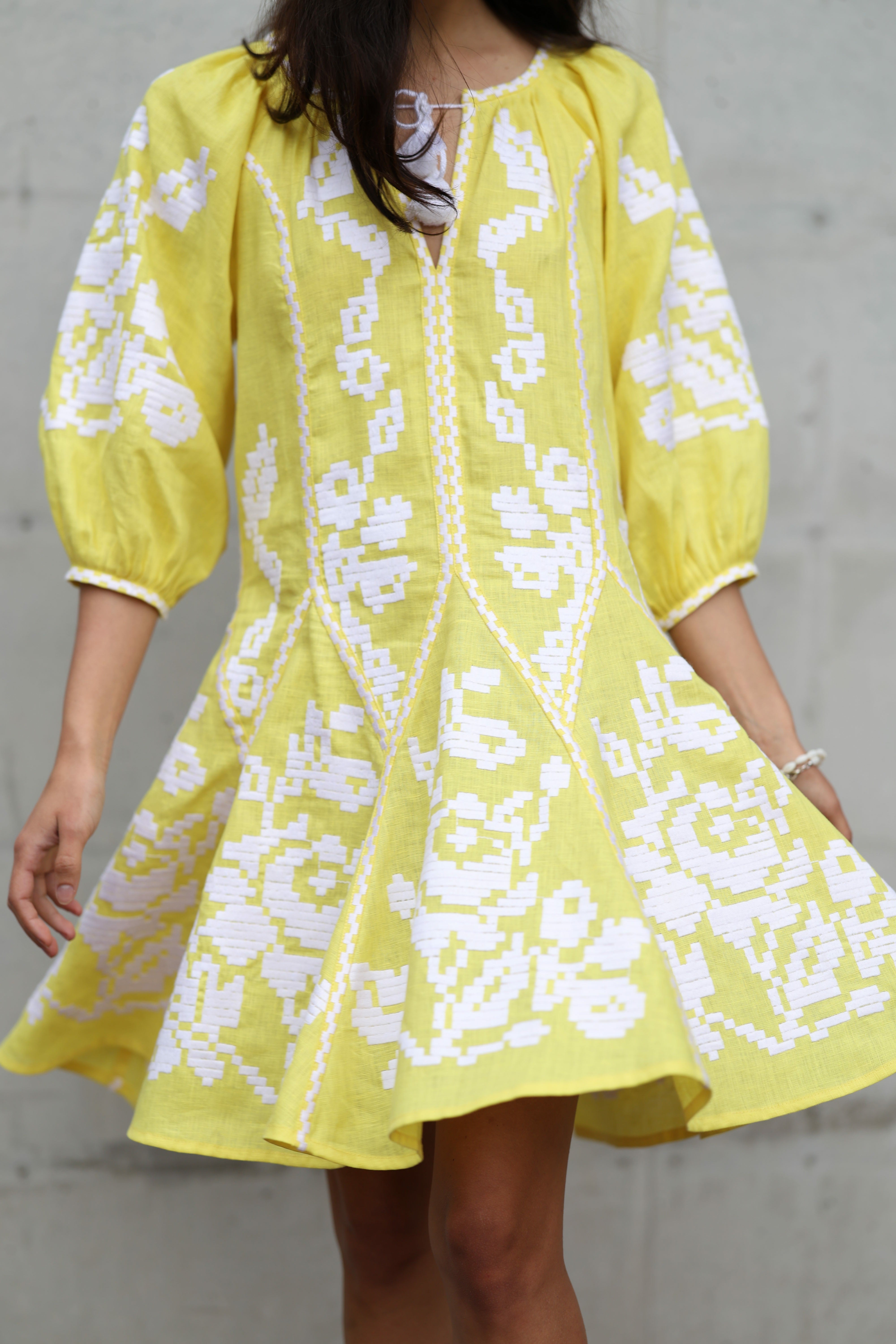 Women's bright yellow embroidered dress with white embroidery