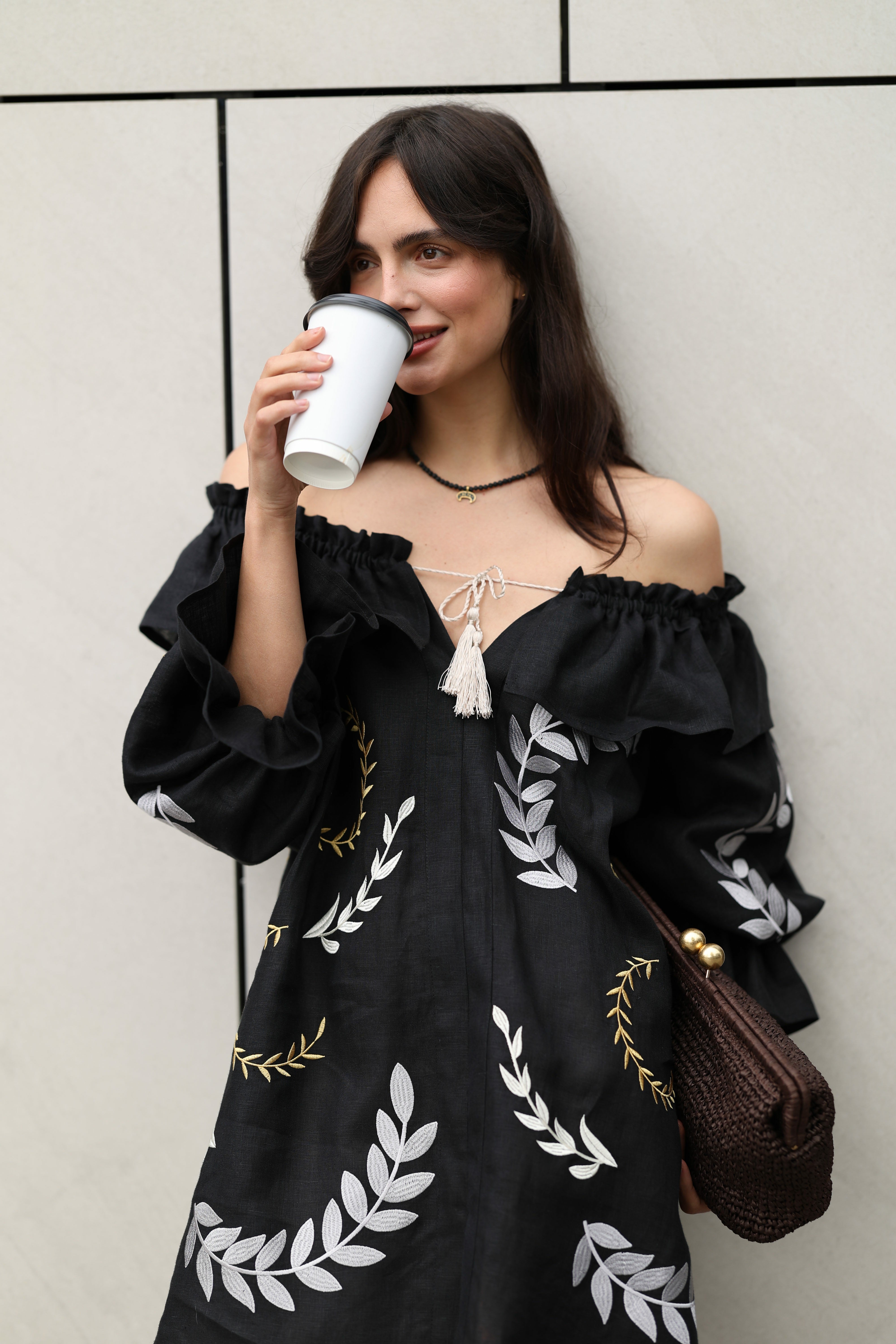 Woman in a black dress with white patterns