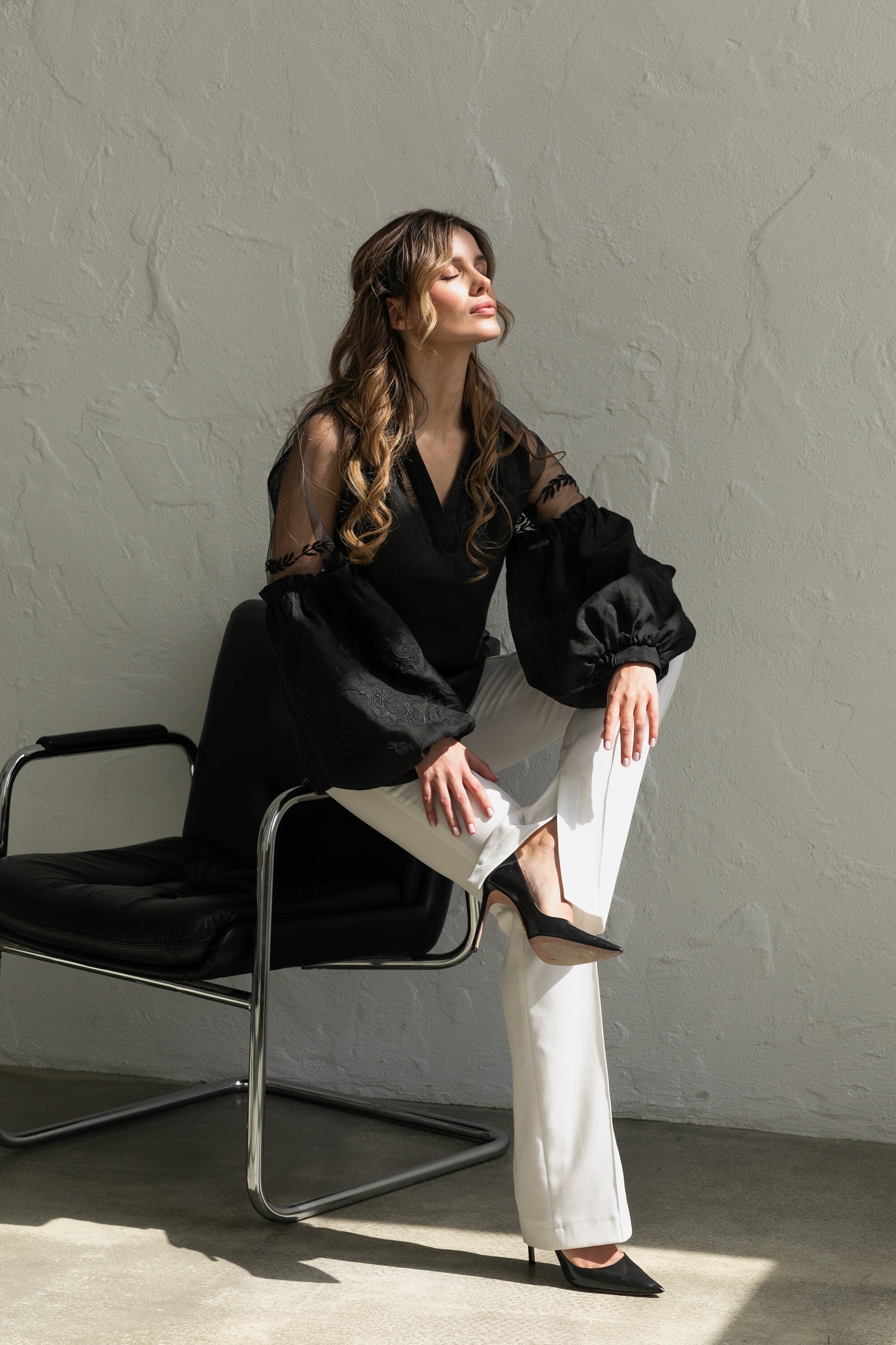 black blouse with sheer sleeves