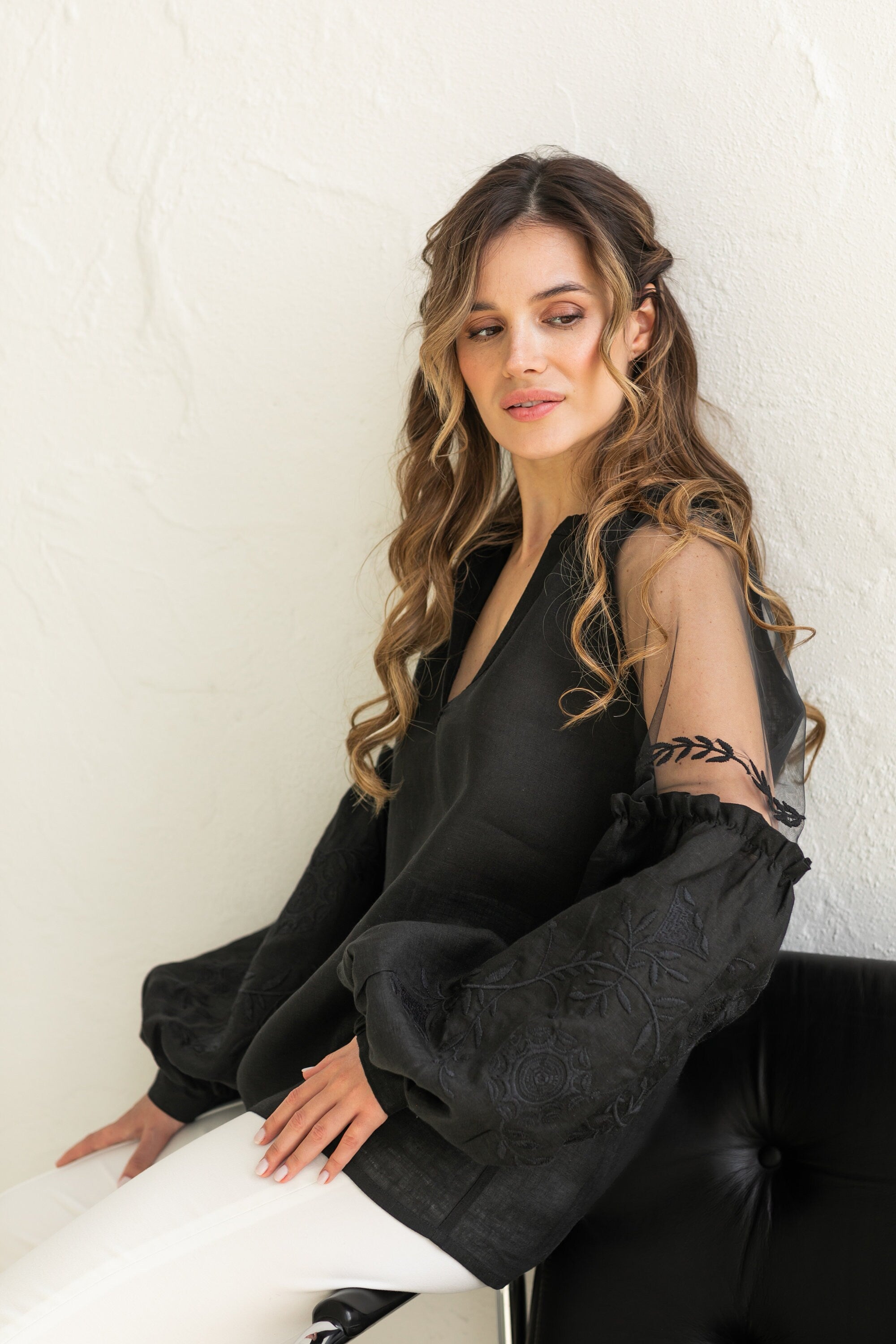 black blouse with sheer sleeves