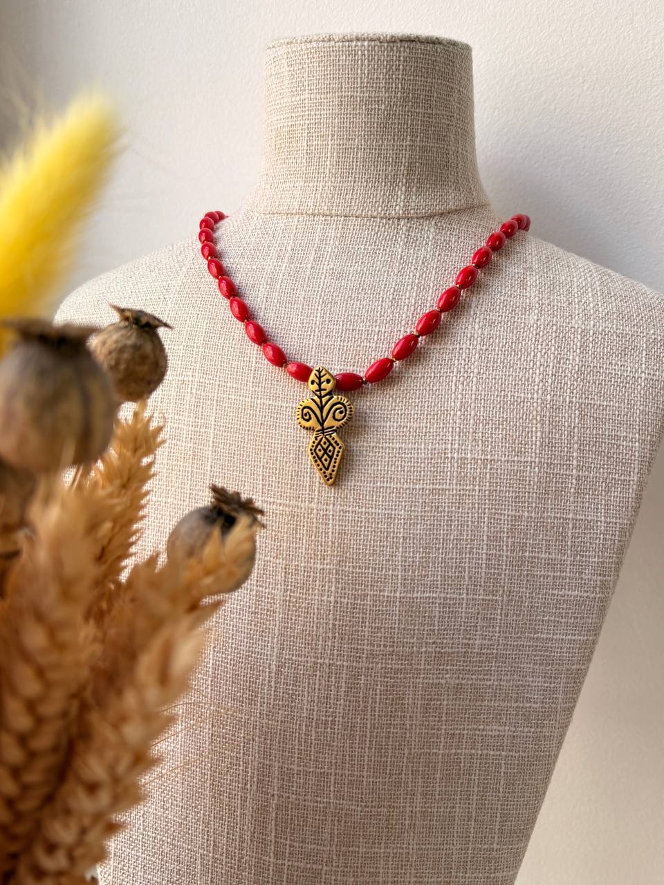 necklace with a gold-toned pendant