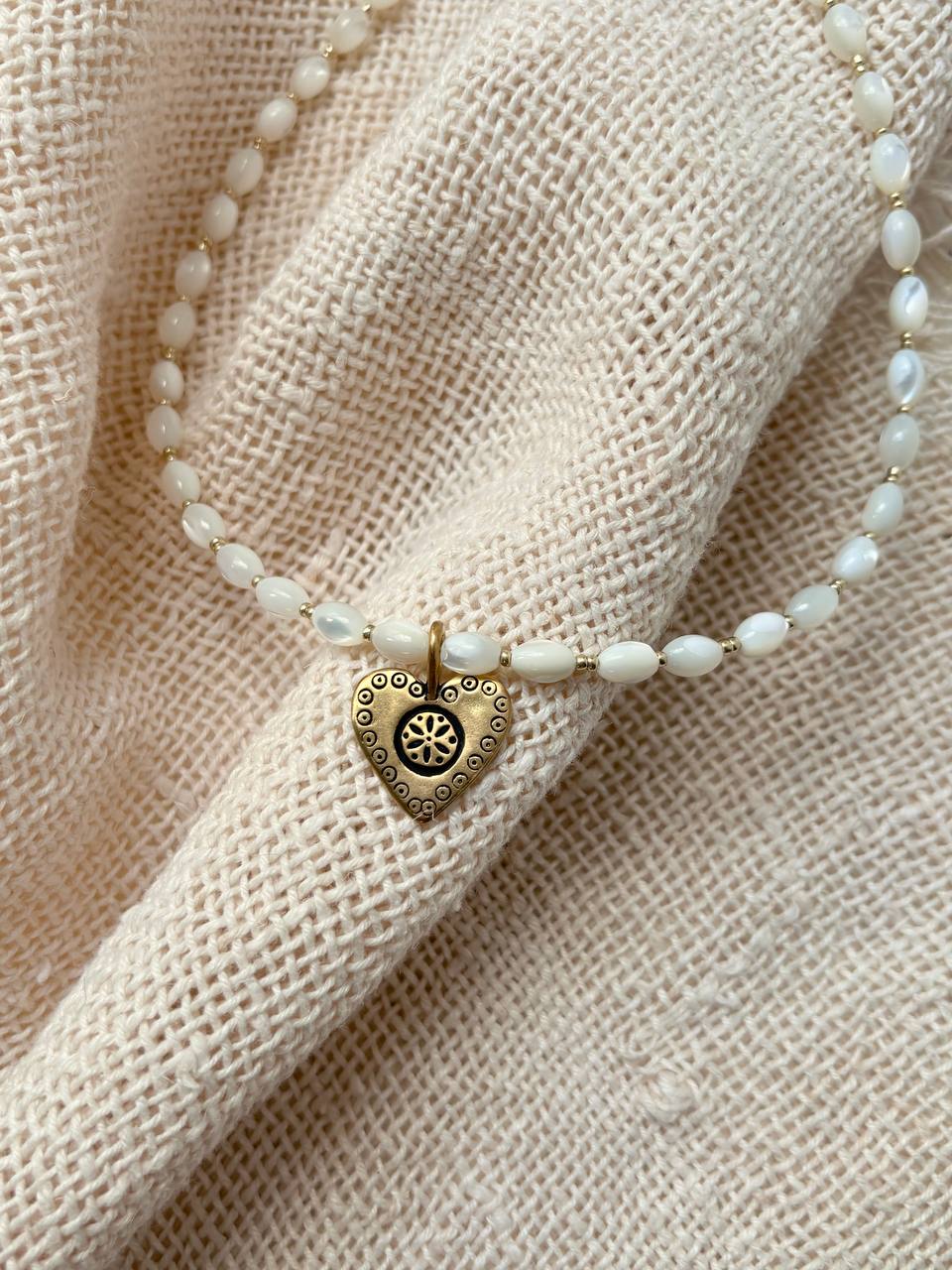 Handmade Romantic Jewelry necklace made of small white pearl-like beads with a gold-toned heart-shaped pendant