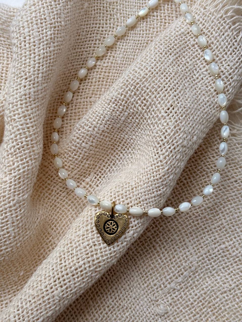 Handmade Romantic Jewelry necklace made of small white pearl-like beads with a gold-toned heart-shaped pendant