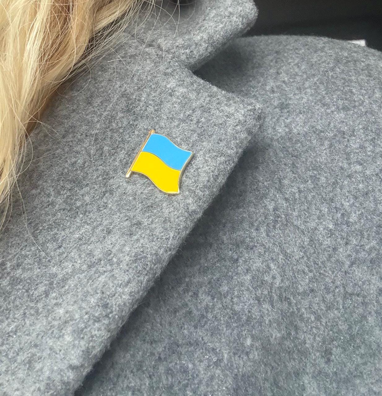 A pin with the design of the Ukrainian flag
