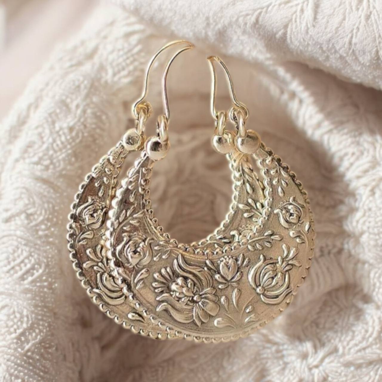silver earrings with intricate designs