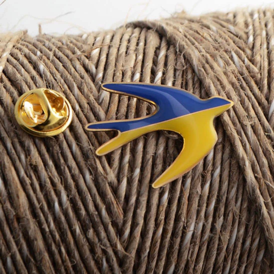 swallow badge with blue and yellow colors