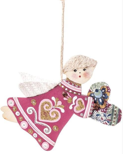 A wooden angel figurine with a multicolored dress, holding a hand-sewn heart-shaped textile,