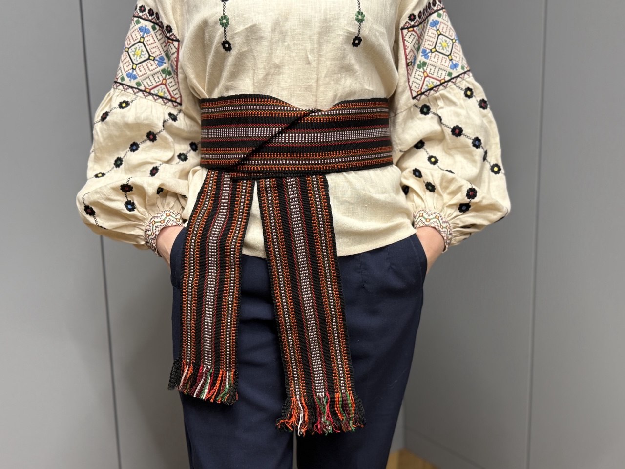 Brown woven belt with a stripe