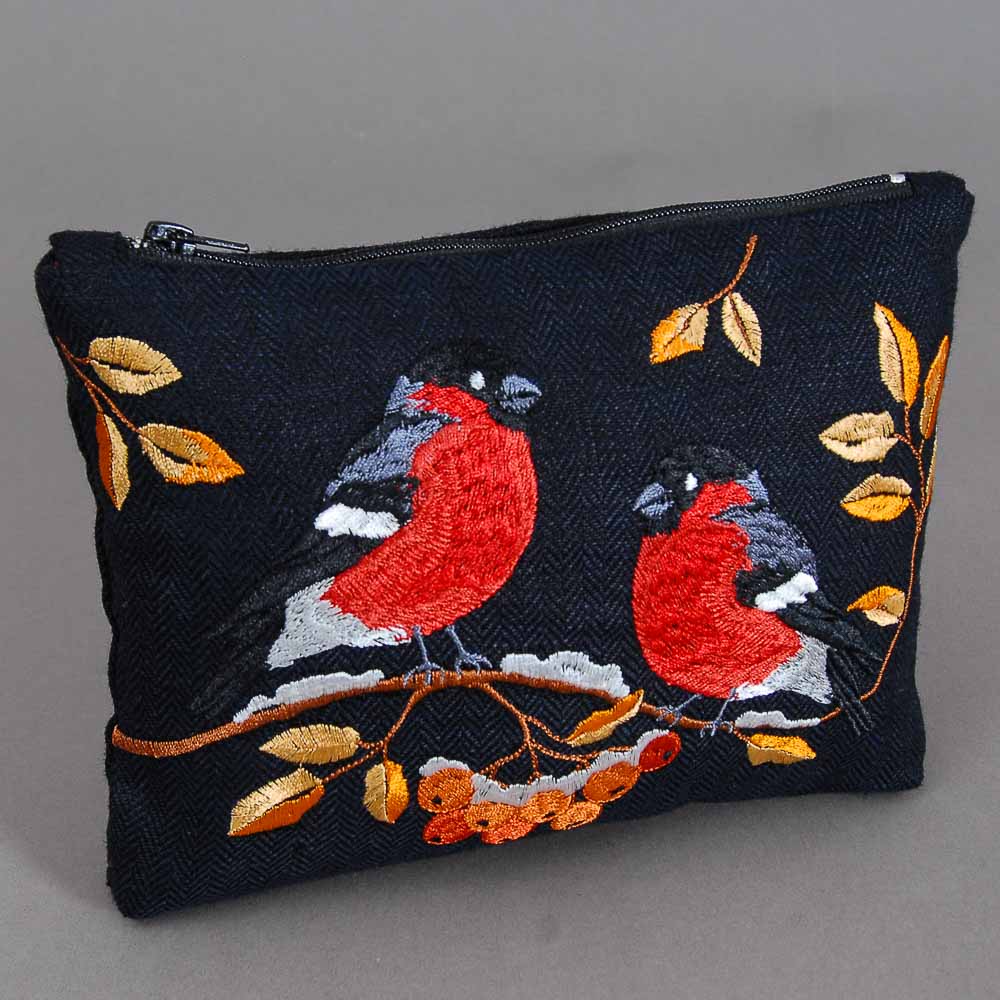 Embroidered pouch with red birds and autumn leaves on a dark background