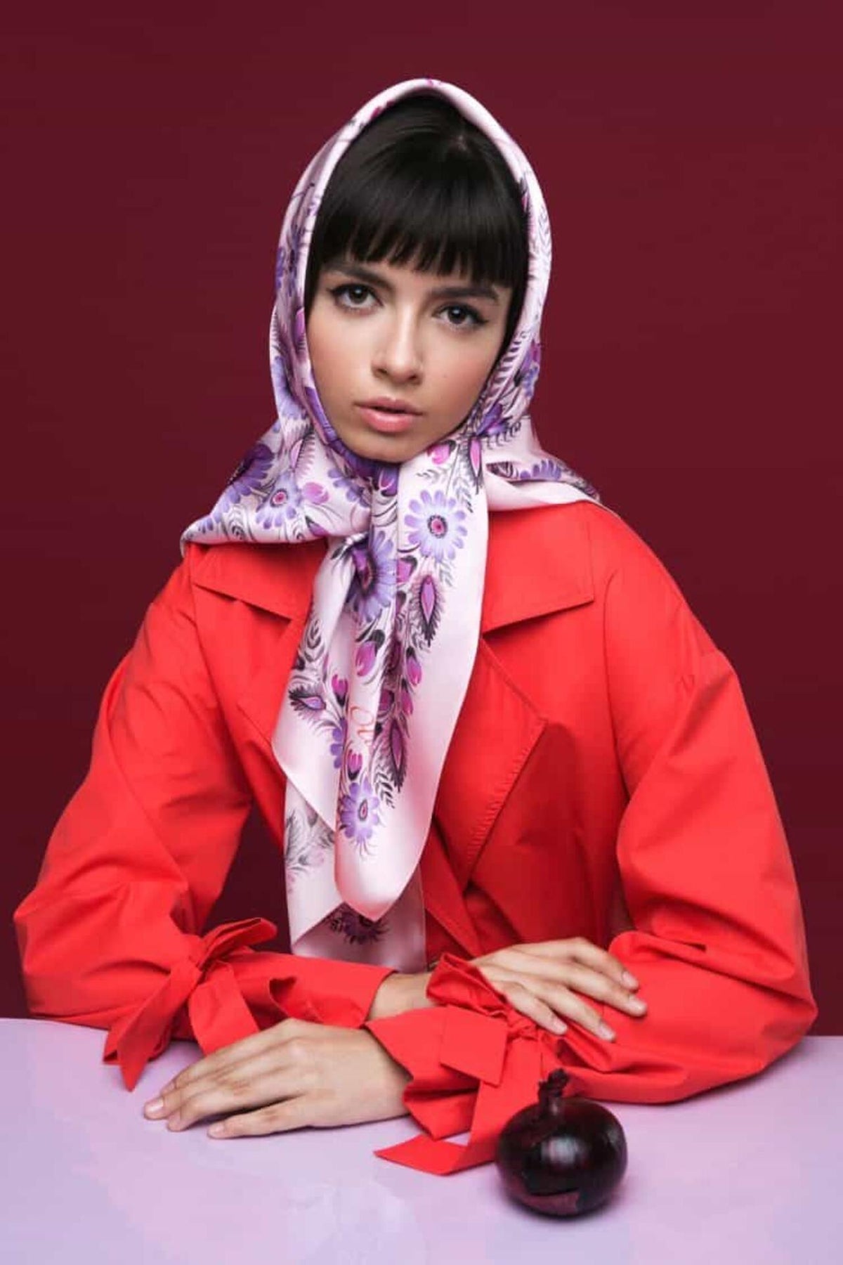 Pink silk shawl  scarf against a red background
