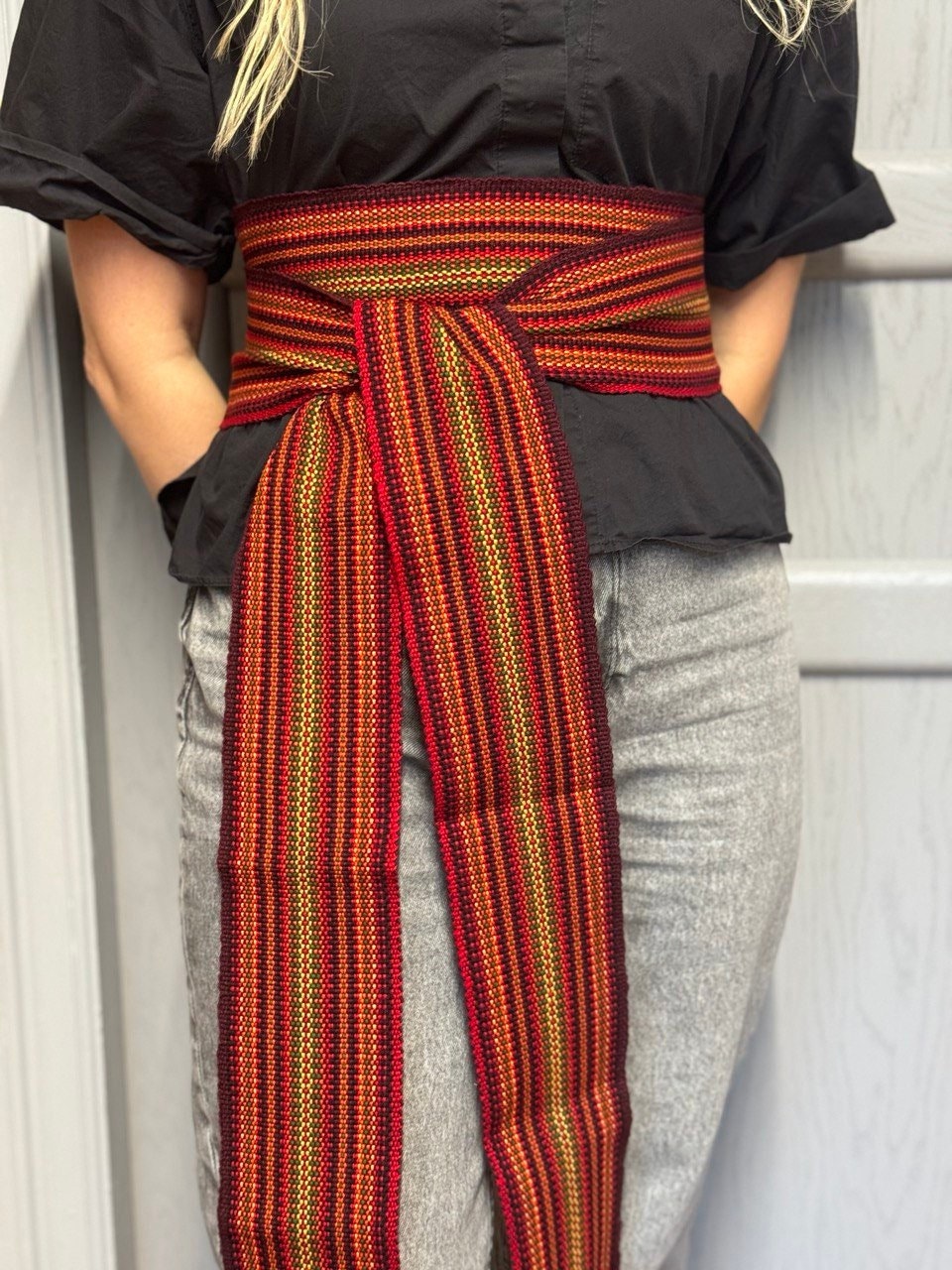 Orange Red woven belt with a geometric pattern 