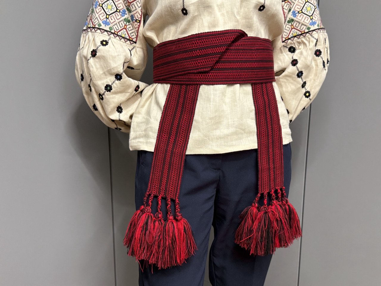 Red woven belt with a geometric pattern 