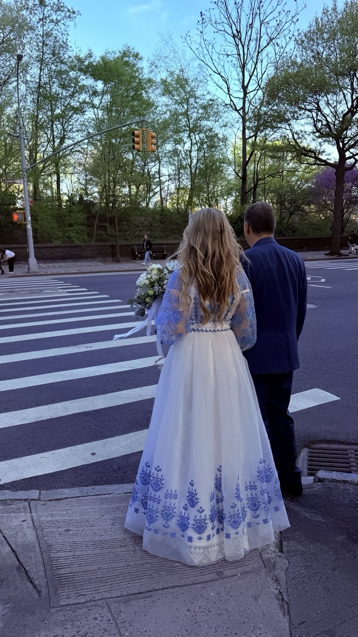 white dress with blue floral embroidery 
