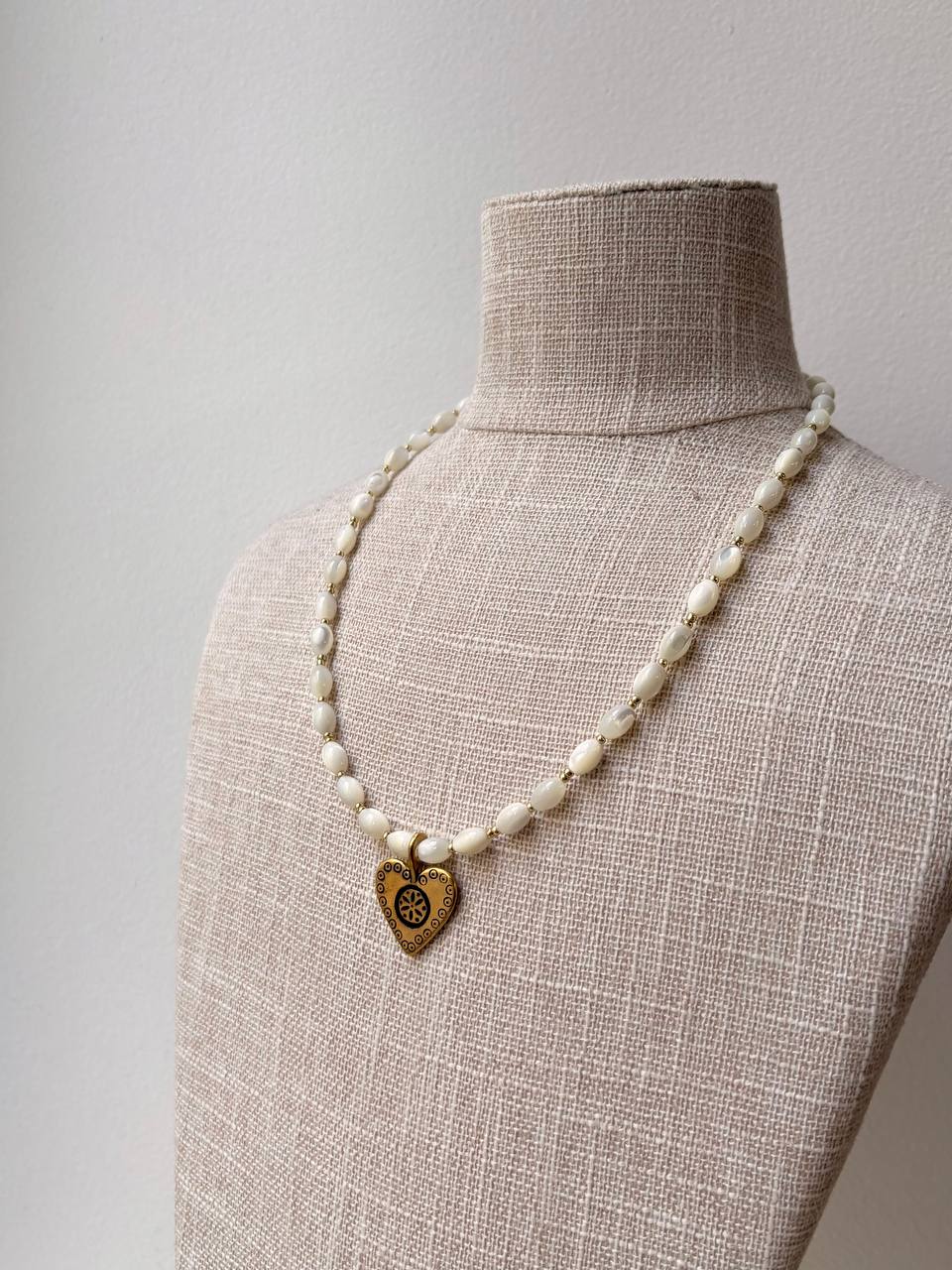 Handmade Romantic Jewelry necklace made of small white pearl-like beads with a gold-toned heart-shaped pendant